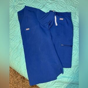 Figs scrub blue with gray string.